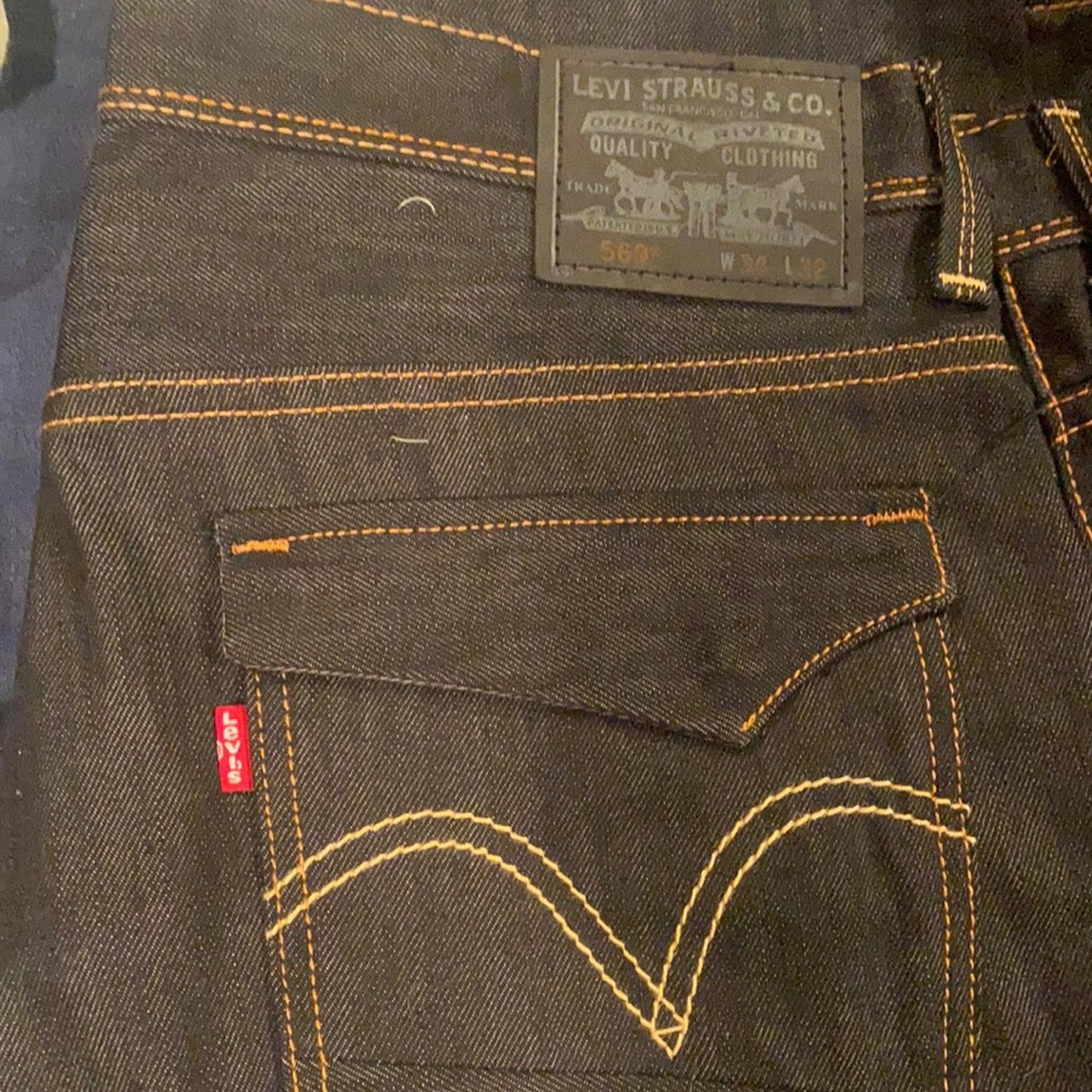 Black denim Levi’s with tan stitching